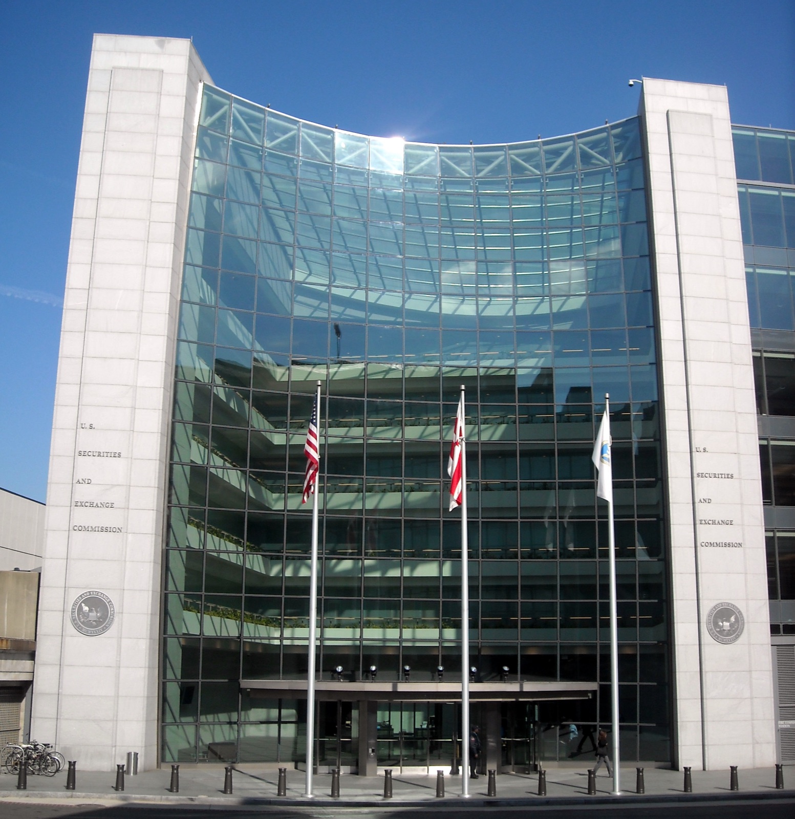 Modern glass and stone office building at 100 F Street NE in Washington, D.C., the headquarters of the U.S. Securities and Exchange Commission, photographed from street level