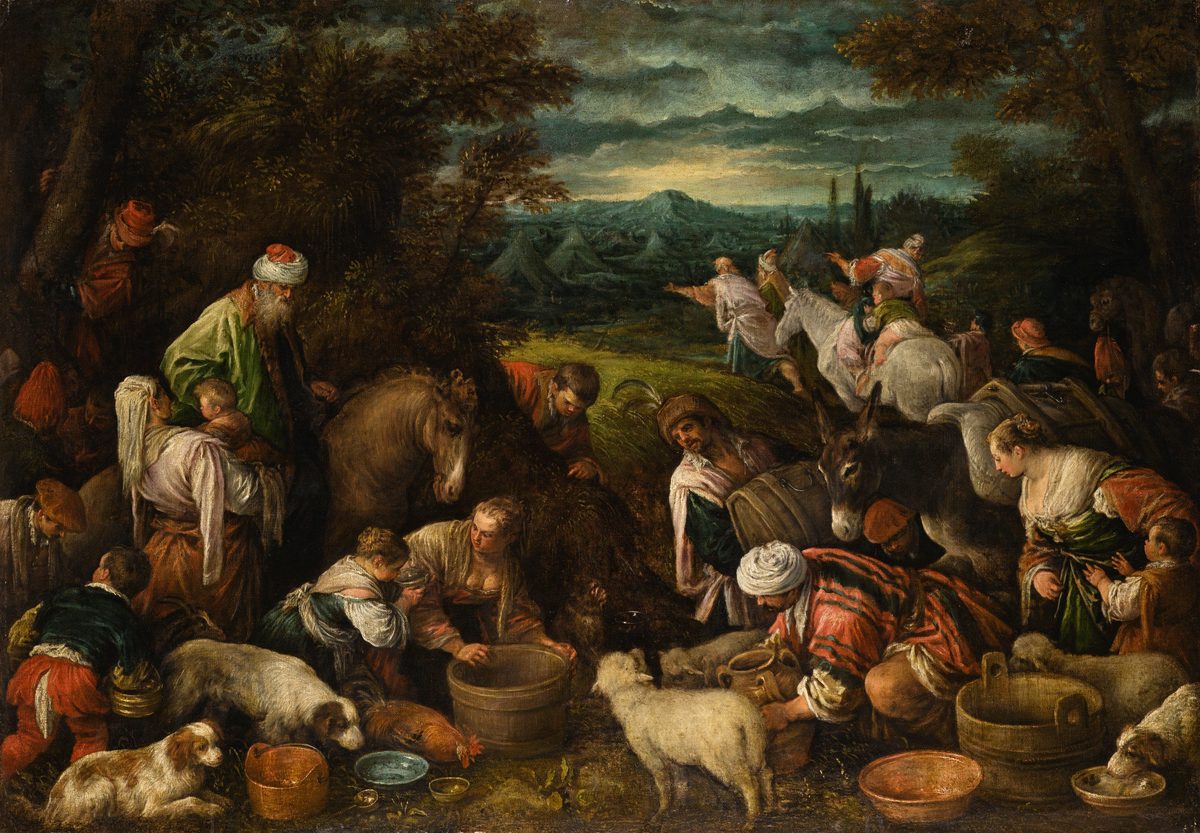 A crowded, low-lit oil painting of a nomadic encampment at dusk. In the foreground, several families draw and pour water into wooden buckets and clay jars, surrounded by sheep, dogs, and pack donkeys; an old bearded man in a turban carries a small child. In the middle distance, riders on donkeys and horses set off toward a valley dotted with tents, with a mountain and storm-lit sky on the horizon.