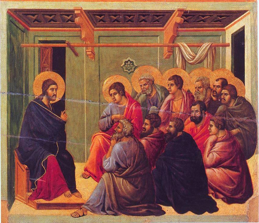 A small gold-ground panel painting. Christ sits at the far left on a low wooden seat, barefoot, one hand raised in a gesture of speech. The apostles are packed shoulder to shoulder in a close crowd filling the rest of the panel, their gold haloes overlapping. Behind them a plain green wall with a dark open doorway at either side and a white curtain looped over a rail. Several of the men are turned toward one another rather than toward Christ