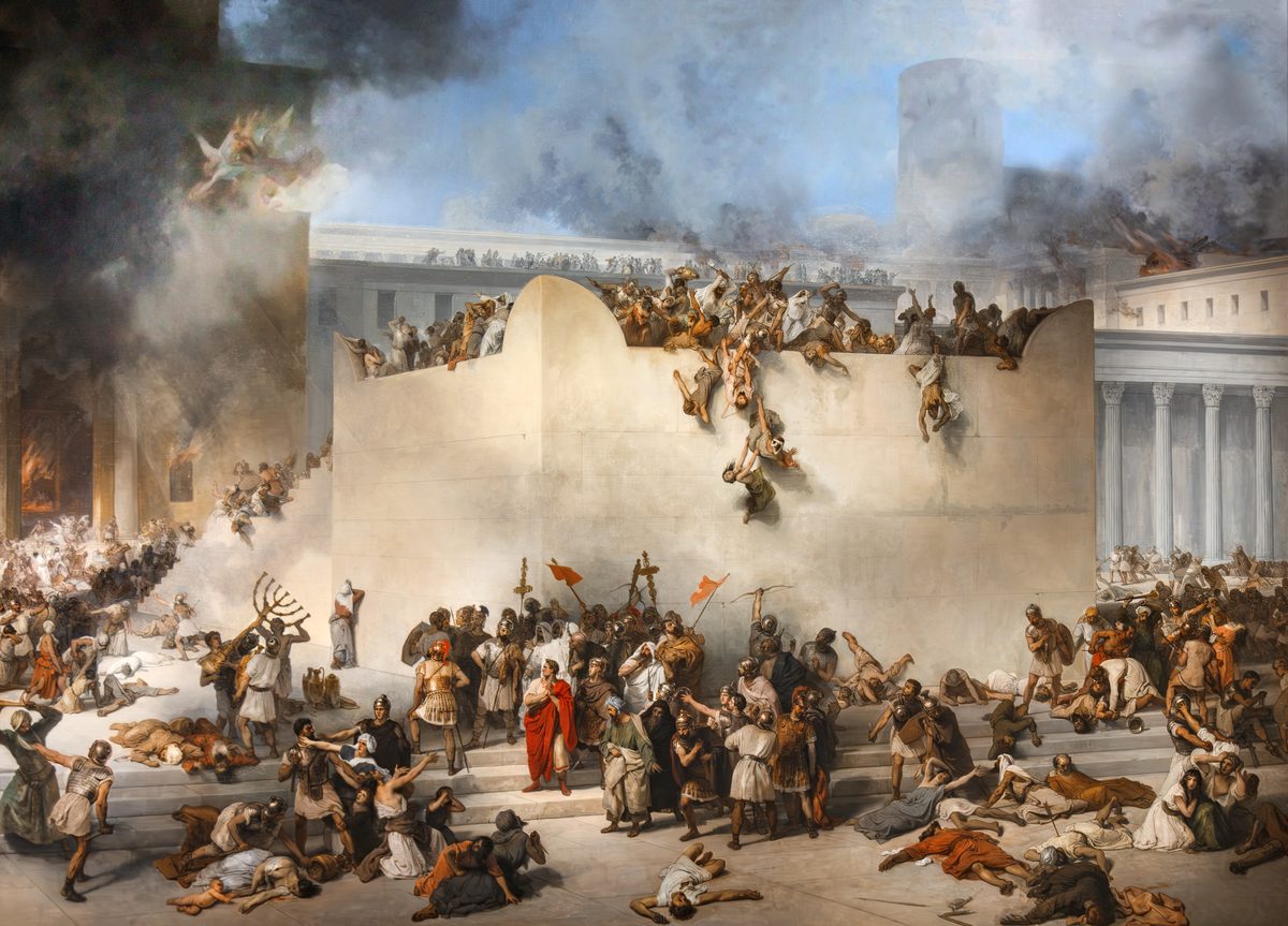 An enormous crowded canvas. A high pale stone wall fills the centre; along its top men fight hand to hand and bodies are thrown off it, one figure falling headlong down the face of the wall. Below, Roman soldiers in helmets stand with red banners and standards around an officer in a scarlet cloak. Dead and dying people lie strewn across the wide temple steps in the foreground. At the left, men carry off a large seven-branched menorah and other temple vessels while fire and black smoke pour from a colonnade; winged figures are visible in the smoke above. Blue sky breaks through at the top right