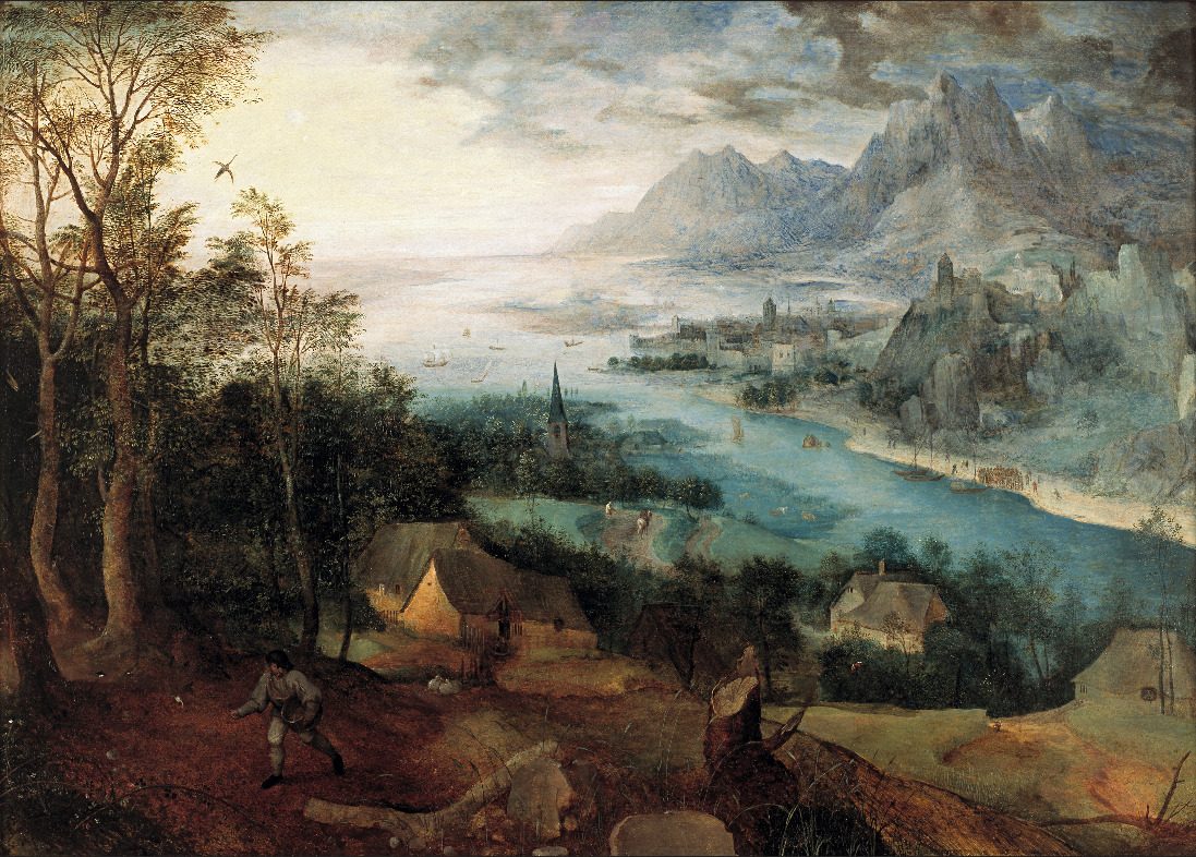 A vast panoramic river-valley landscape in the Flemish 'world landscape' style, dominated by jagged blue mountains, a fortified town on the far bank, and small boats on the water. In the shadowed lower-left foreground, small and easy to miss against the scenery, a lone sower in work clothes strides across a furrowed field, one hand reaching into a basket of seed slung at his hip.