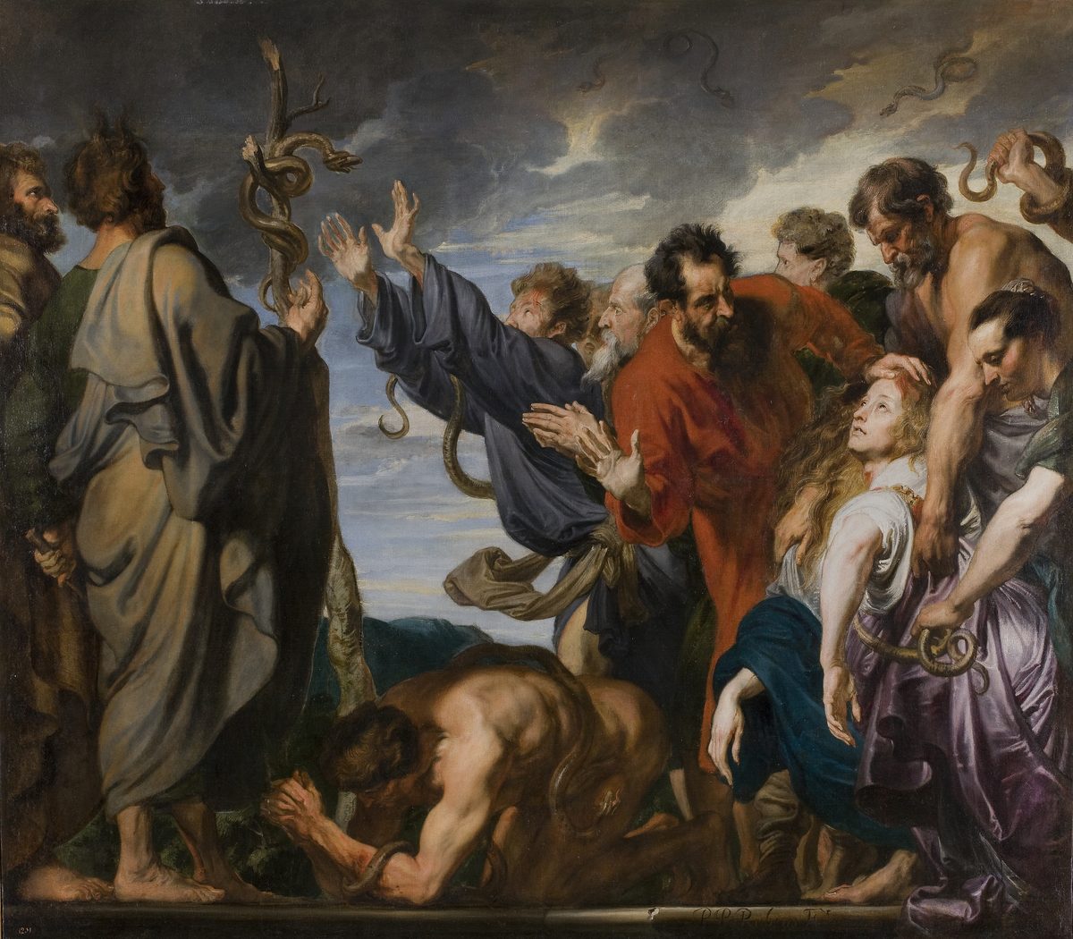 A large dark oil painting. At the left a tall figure seen from behind, in a grey-blue cloak over olive, raises a bare forking branch with a serpent coiled around it against a stormy sky. In the centre a man in a slate-blue robe flings both arms upward toward it, a snake draped over his outstretched arm; beside him a bearded man in a bright red cloak turns away with his hands raised. At the right a bare-shouldered man holds a writhing snake at arm’s length above his head, and a young woman with loose fair hair looks upward while another figure steadies her head, a snake coiled against her purple robe. In the foreground a nearly naked man crouches face-down on the ground with a snake looping over his arm. Two small serpents are painted high in the dark clouds.