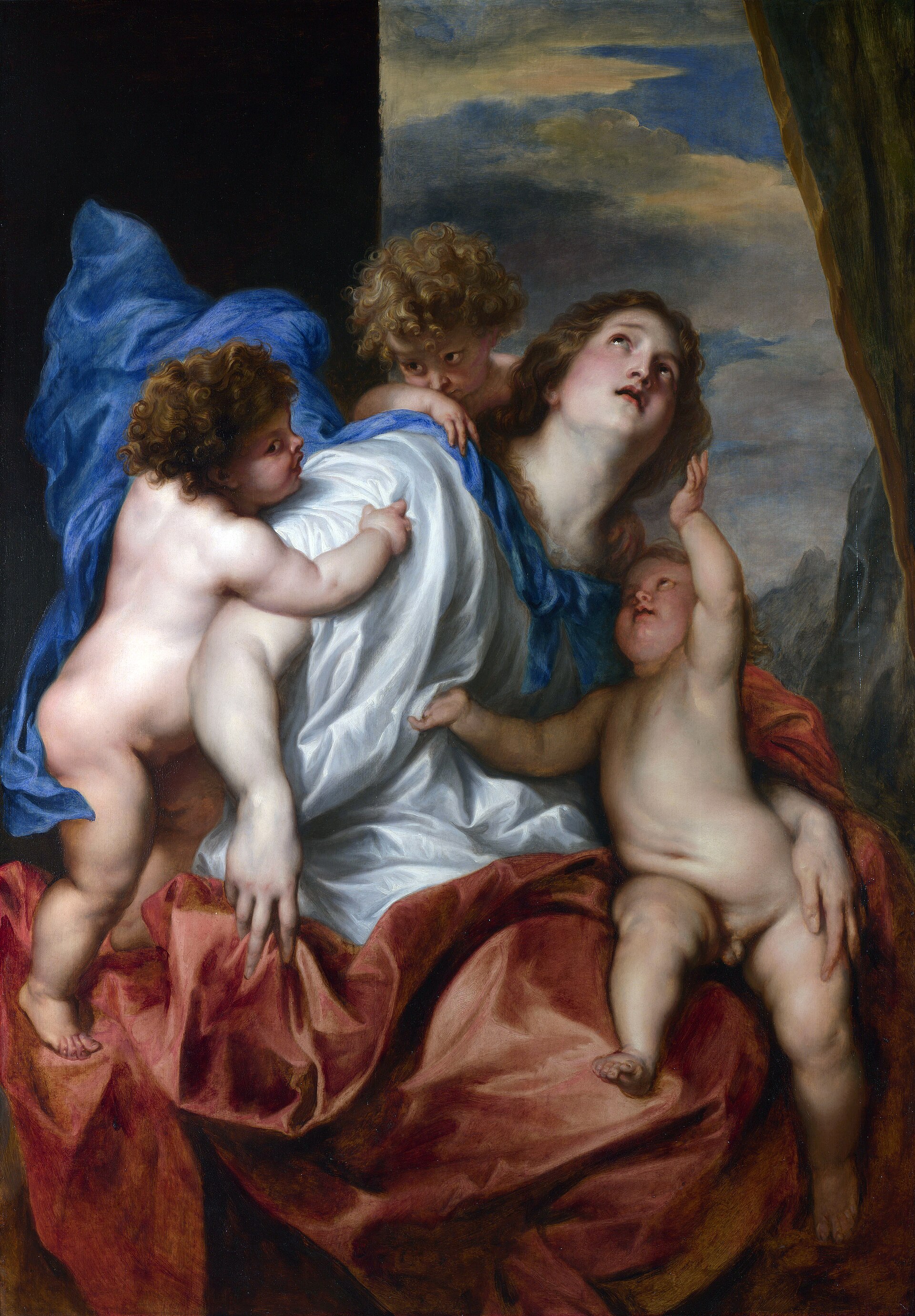 A woman in white and blue robes looks upward with three naked infants clinging to her — one climbing her back, one at her shoulder, one reaching up from her lap