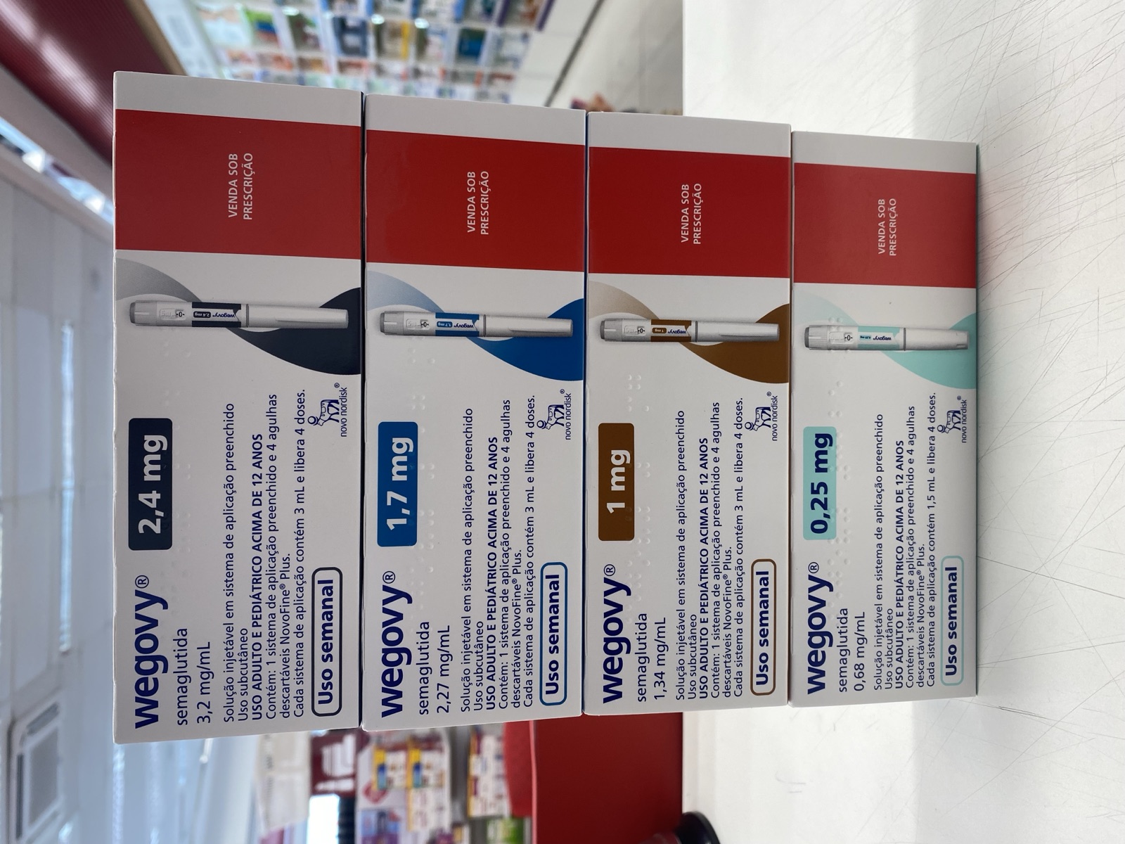 Four Wegovy semaglutide injection pens of different doses, laid out side by side