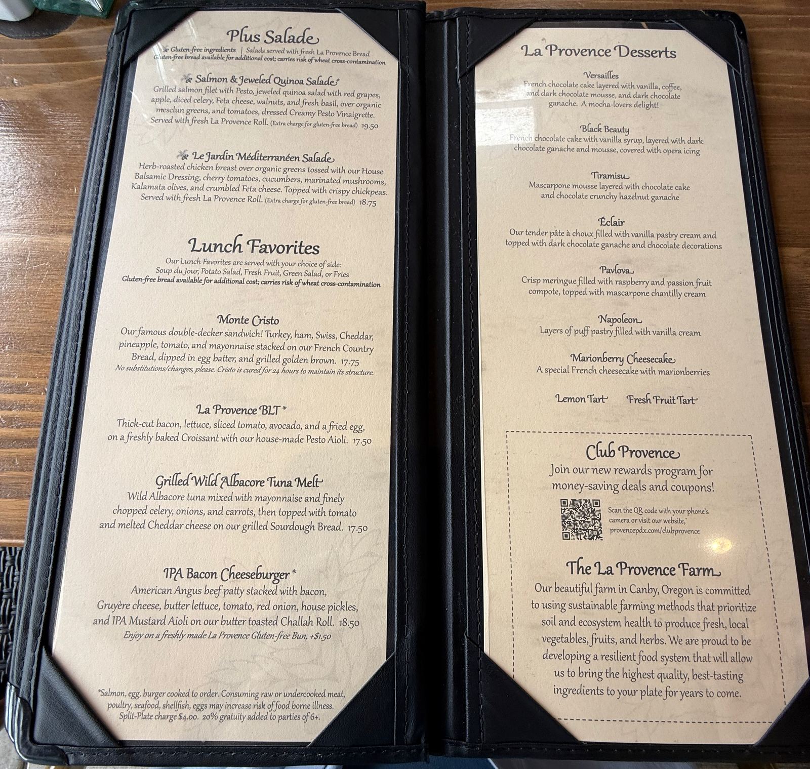 The La Provence lunch and dessert menu pages, left listing salads, the Monte Cristo at 17.75, La Provence BLT, grilled albacore tuna melt and IPA bacon cheeseburger, right listing desserts including Versailles, Black Beauty, Tiramisu, Éclair, Pavlova, Napoleon and marionberry cheesecake, plus panels for Club Provence and The La Provence Farm in Canby, Oregon