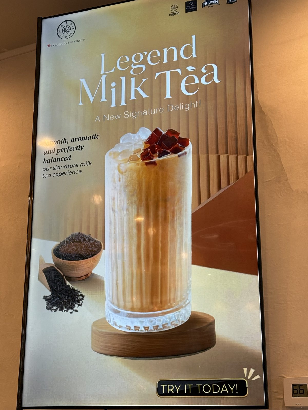 Digital menu board for Legend Milk Tea, an iced milk tea topped with tapioca-style pearls